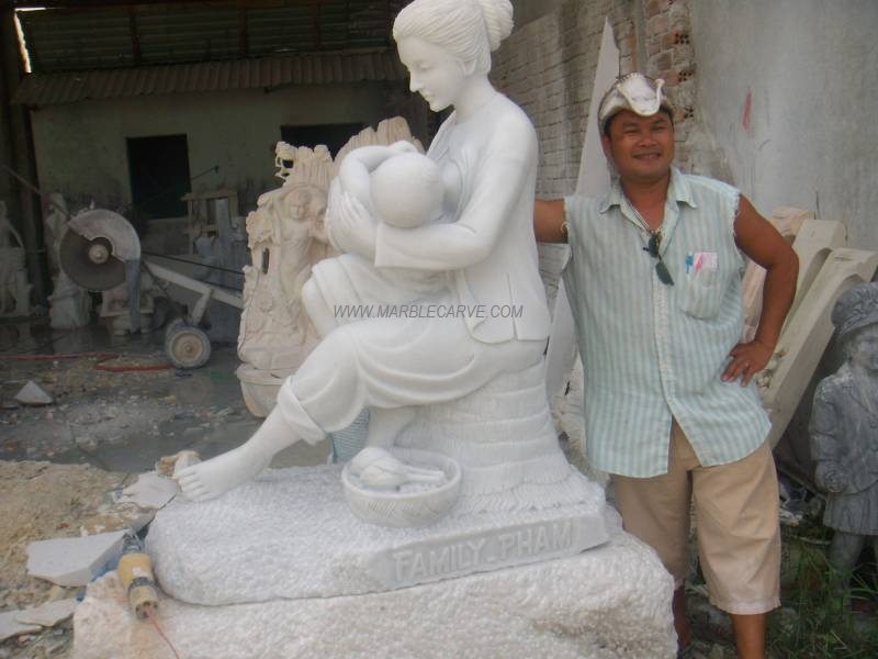 marble carving sculpture mother and baby statue photo image